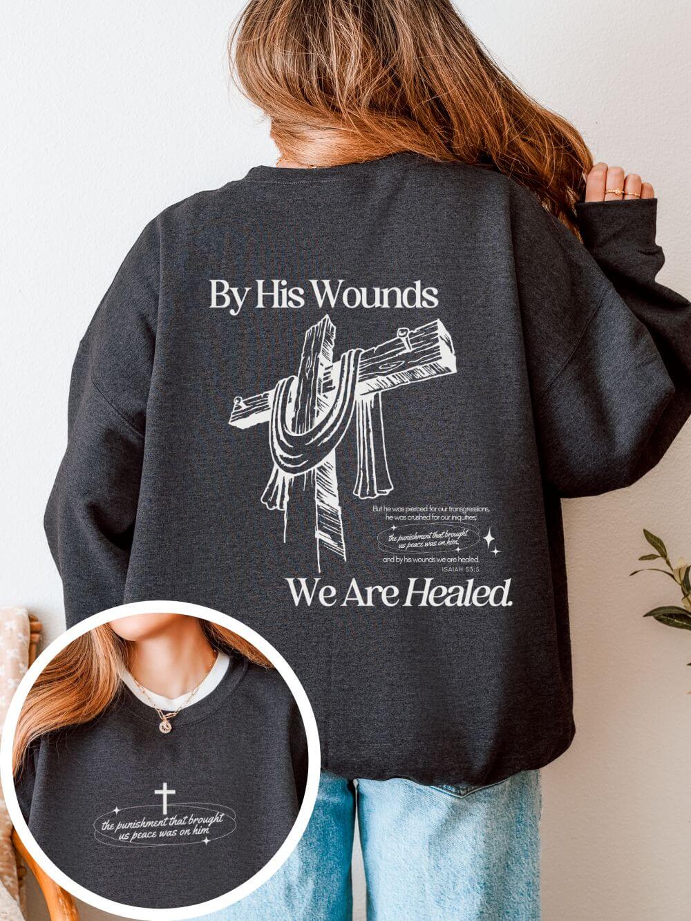 By_His_Wounds_Both_Dark_Heather By His Wounds We Are Healed Unisex Christian Religious Graphic Crewneck Sweatshirt - Image 1