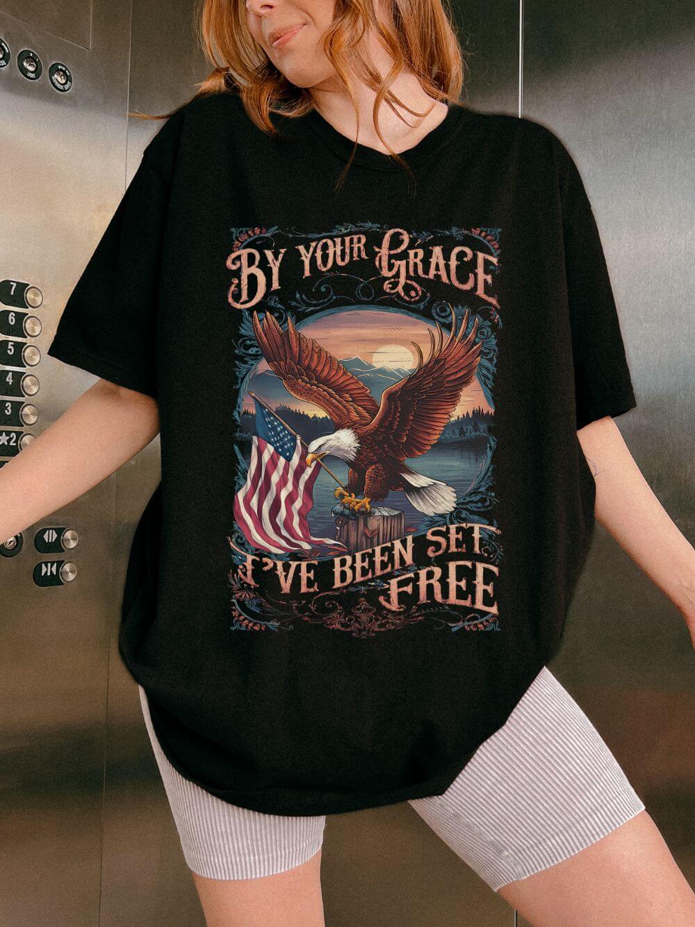 By_Your_Grace_Eagle_Black By Your Grace I've Been Set Free' T-Shirt Eagle & Flag Christian Graphic Tee - Image 1