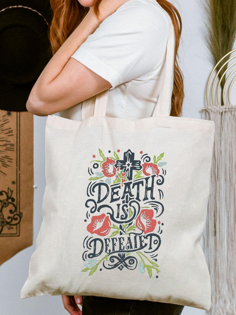 Death_is_Defeated_Tote Death Is Defeated Floral Cross Christian Cotton Canvas Tote Bag - Image 1