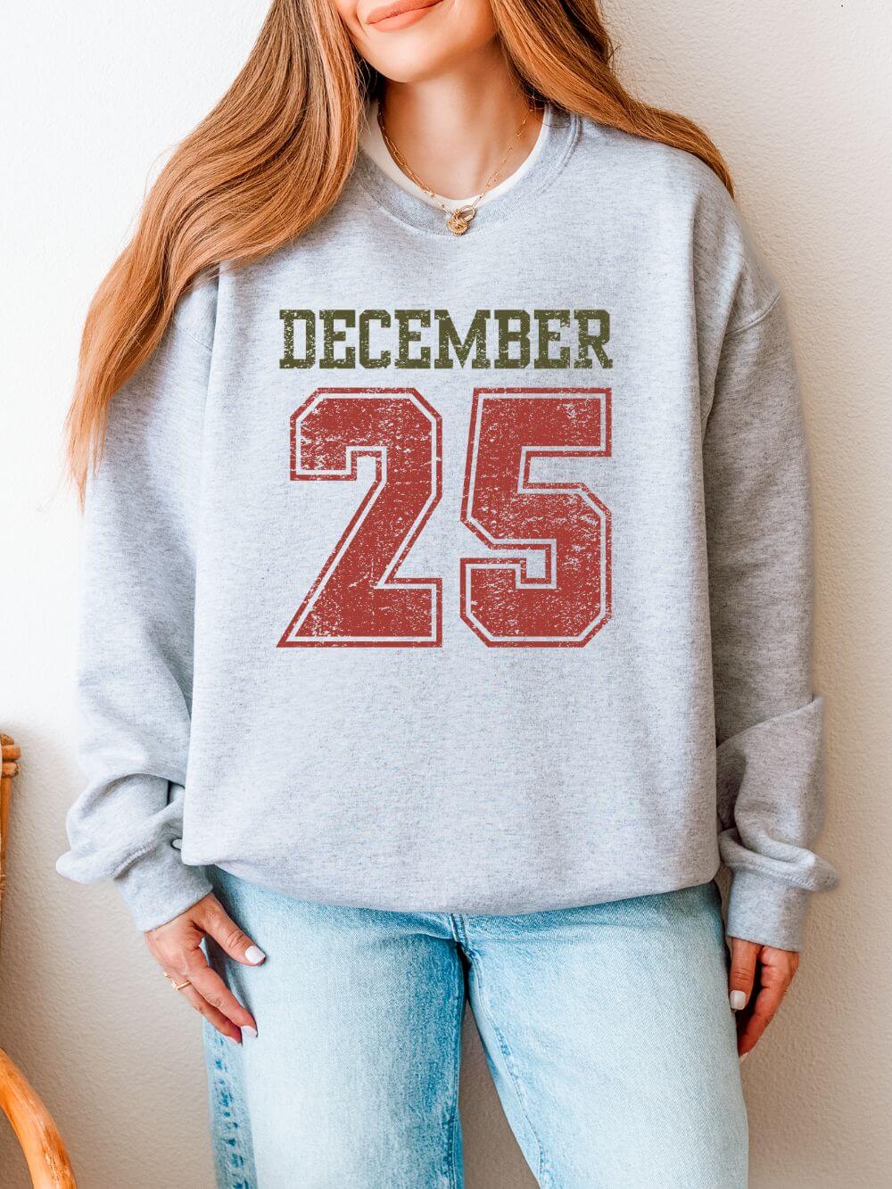 December_25_Ash December 25 Vintage Distressed Heavy Blend Unisex Crewneck Cozy Christmas Sweatshirt - Image 1