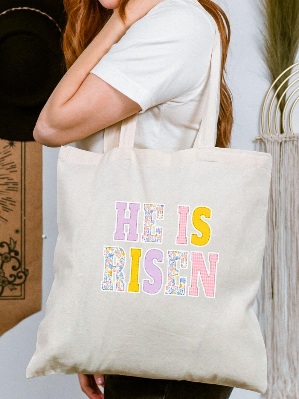 He_Is_Risen_Tote He Is Risen Canvas Tote Bag Easter Floral Faith Grocery & Church Bag - Image 1
