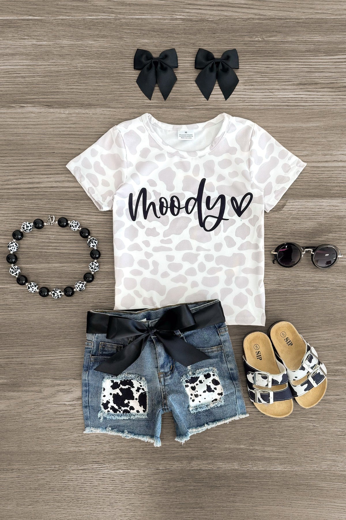 IMG_8963-Edit_1ce1546e-a9f7-49a0-bb0e-60e2a411eb02 "Moody" Cow Print Denim Short Set - Image 1