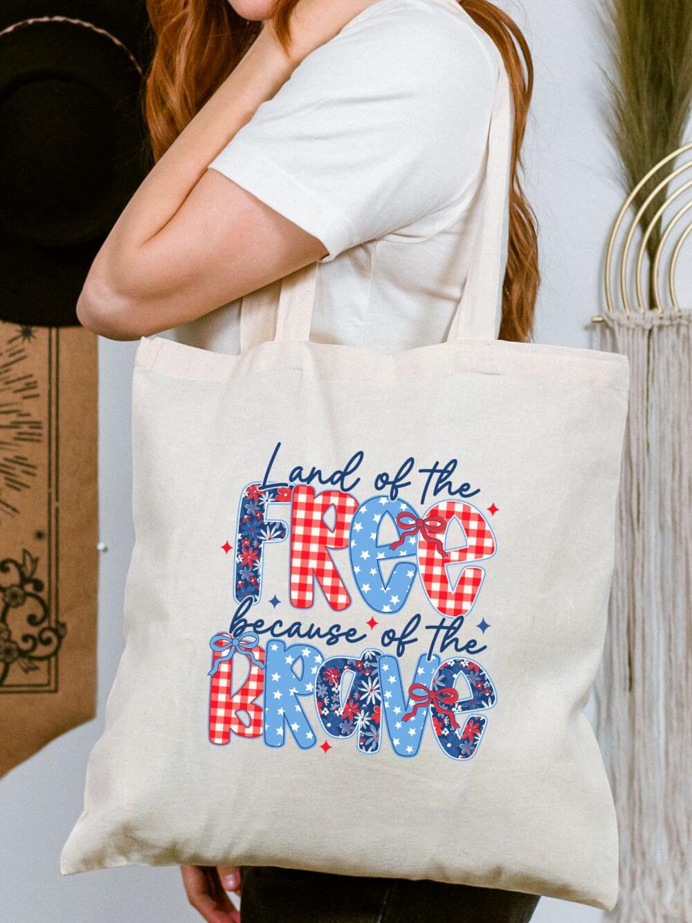 Land_of_the_Free_Tote Land of the Free Because of the Brave Cotton Canvas Tote Bag - Image 1