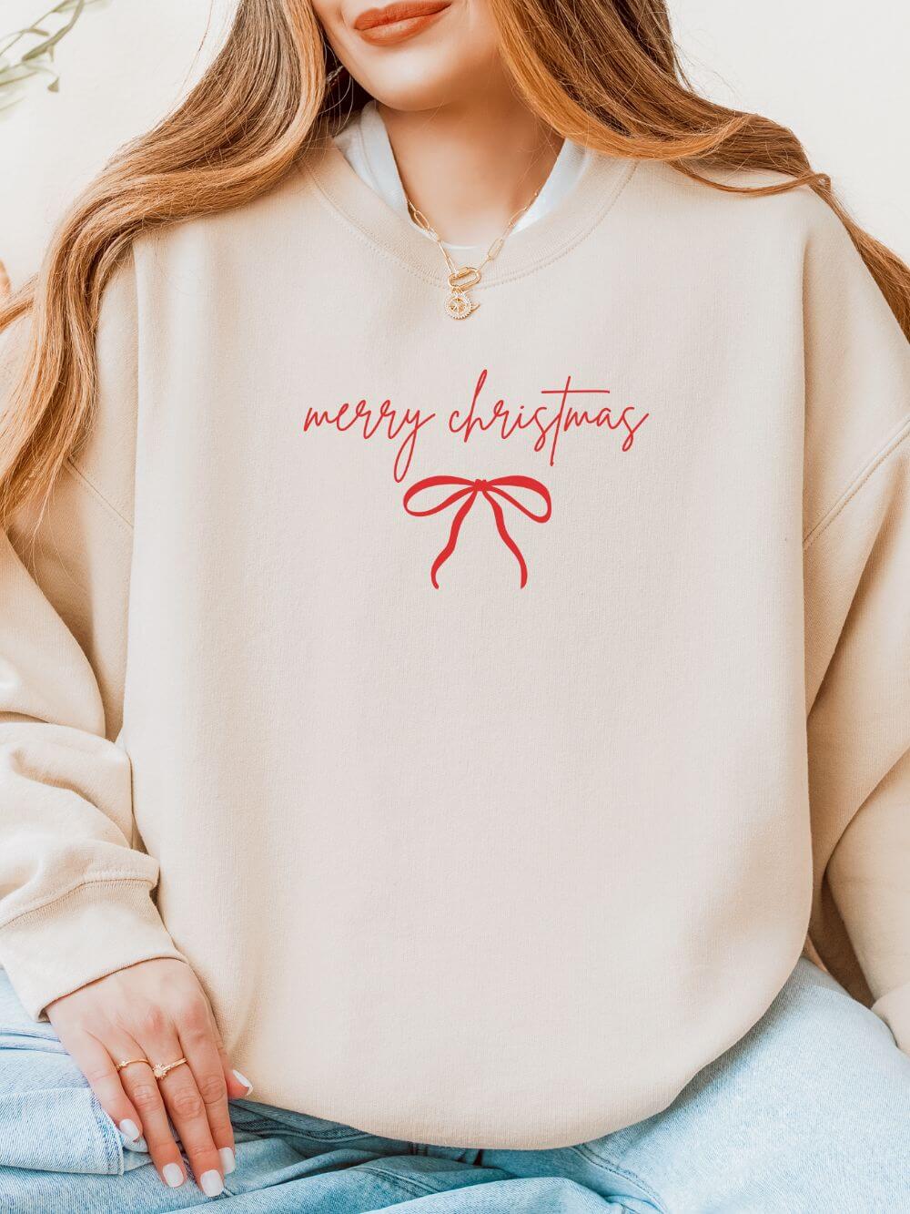 Red_Bow_Embroidered_Sand Red Bow Merry Christmas Script Heavy Blend Women's Crewneck Embroidered Holiday Sweatshirt - Image 1