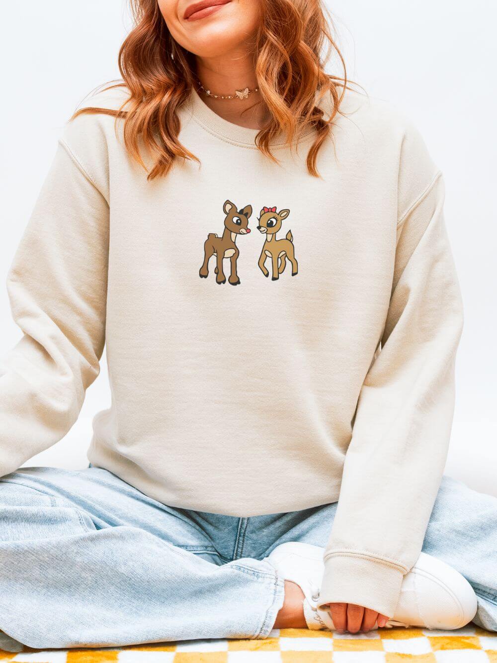 Reindeer_Friends_Sand Reindeer Friends Christmas Heavy Blend Women's Crewneck Embroidered Sweatshirt - Image 1