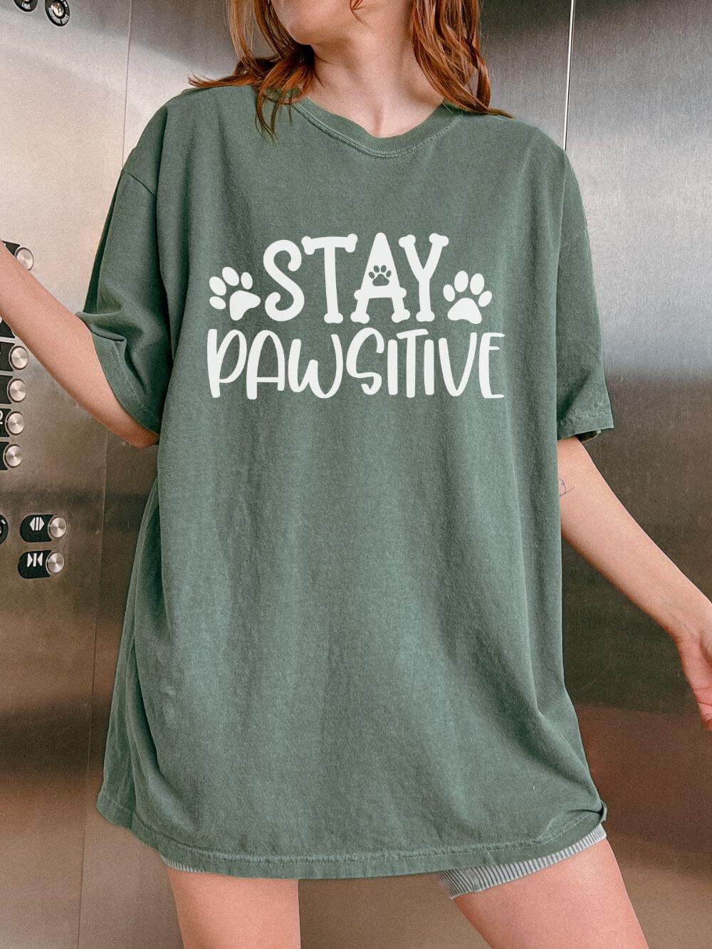 Stay_Pawsitive_Moss Stay Paw-sitive Paw Print T-Shirt Cute Dog Mom Graphic Tee - Image 1