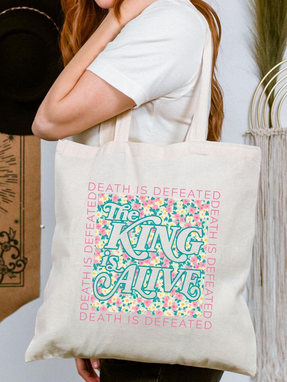 The_King_is_Alive_Tote The King is Alive Christian Floral Easter Cotton Canvas Tote Bag - Image 1