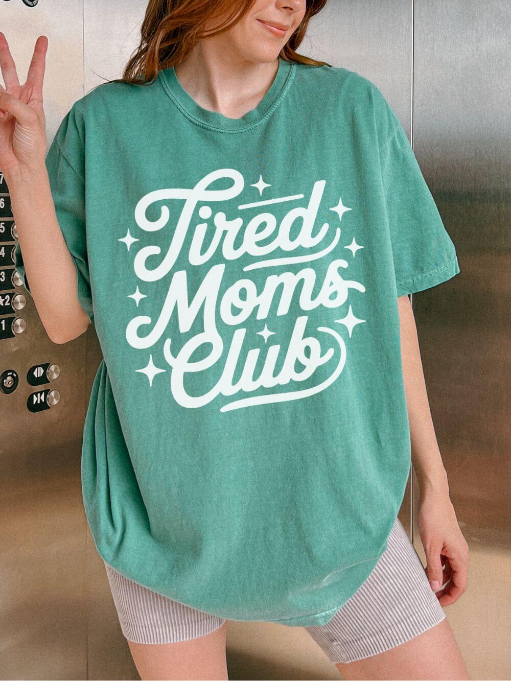 Tired_Moms_Club_Light_Green Tired Moms Club Mom T-Shirt Cute Script Graphic Tee - Image 1