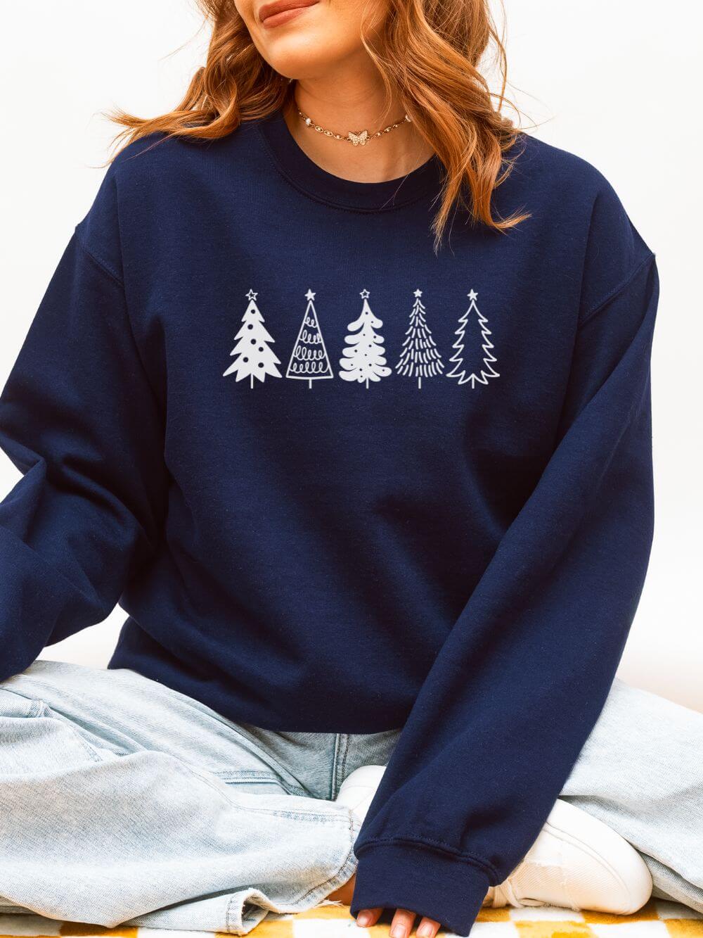 White_Trees_Navy Christmas Trees Heavy Blend Women's Crewneck Embroidered Sweatshirt - Image 1